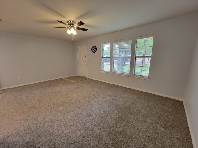 carpeted empty room with ceiling fan