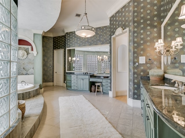 bathroom with tiled bath, tile floors, vanity, and a chandelier