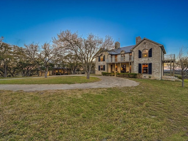 back of house with a yard