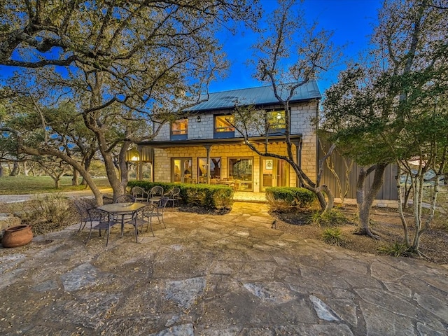 rear view of house with a patio