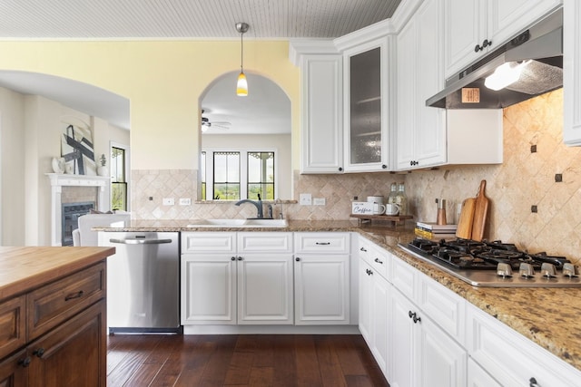 kitchen featuring sink, white cabinetry, stainless steel appliances, and dark hardwood / wood-style flooring