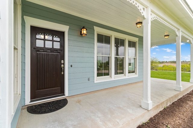 entrance to property with covered porch