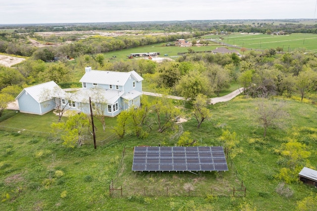 birds eye view of property with a rural view