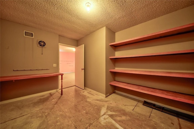 interior space with a textured ceiling