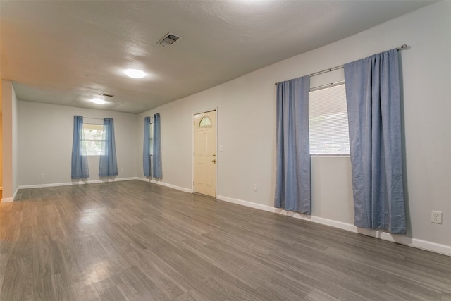 empty room featuring hardwood / wood-style flooring