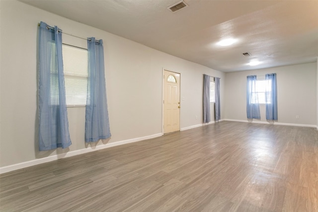 spare room featuring hardwood / wood-style floors