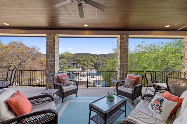 view of patio / terrace featuring ceiling fan, an outdoor hangout area, and a balcony