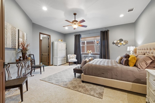 bedroom with light colored carpet and ceiling fan