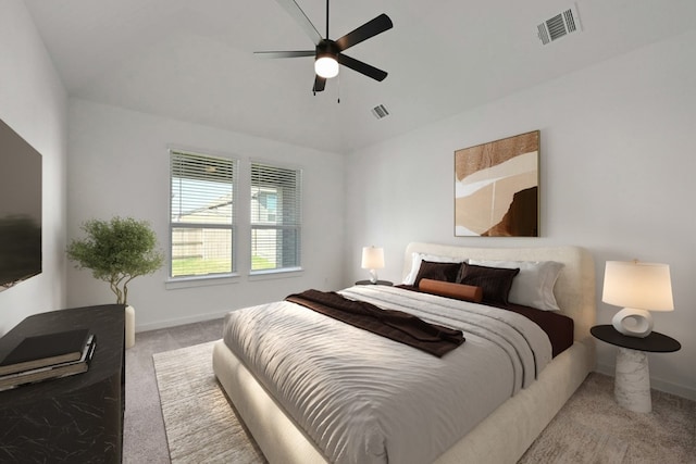 bedroom featuring ceiling fan and light carpet