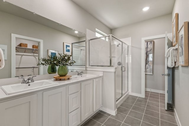 bathroom with vanity, tile patterned flooring, and a shower with door