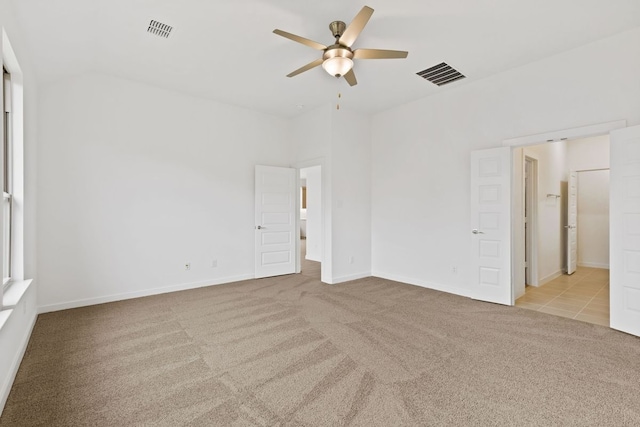 empty room with light carpet and ceiling fan