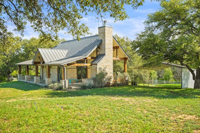 back of house featuring a yard