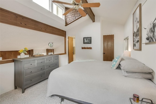 carpeted bedroom with beam ceiling, ceiling fan, and high vaulted ceiling