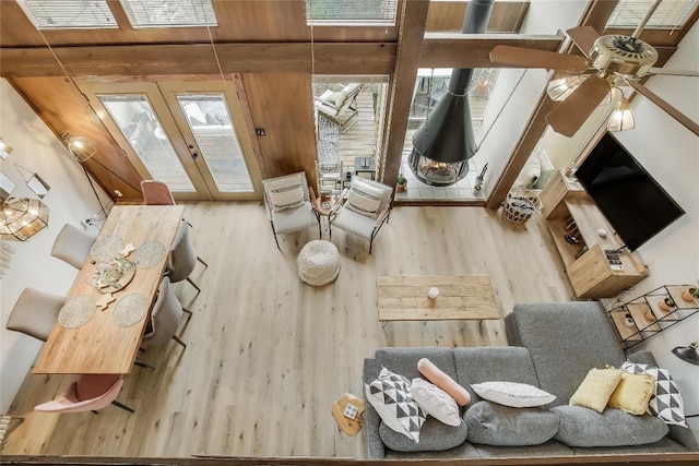 interior space with plenty of natural light, ceiling fan, and wood-type flooring