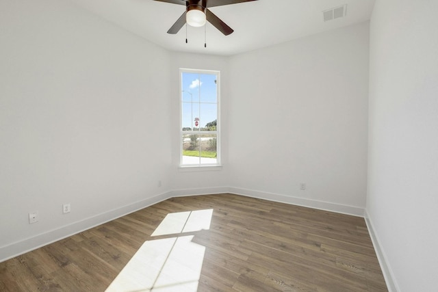 spare room with ceiling fan and hardwood / wood-style flooring