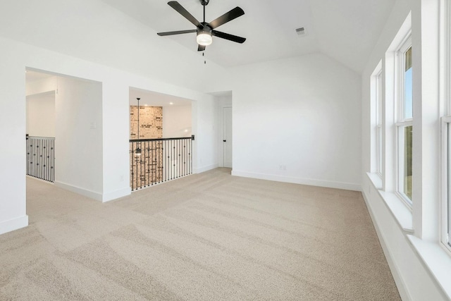 unfurnished room with light carpet, lofted ceiling, and ceiling fan