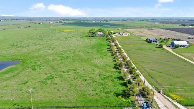 birds eye view of property featuring a rural view