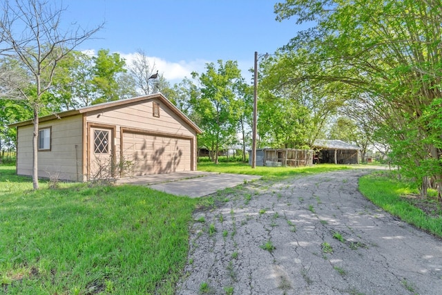 garage featuring a lawn