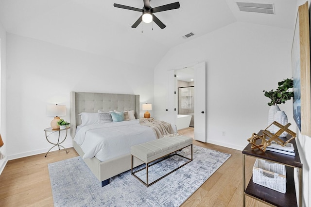 bedroom featuring lofted ceiling, ceiling fan, light hardwood / wood-style floors, and ensuite bathroom