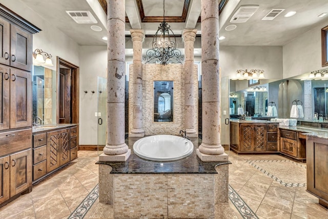 bathroom featuring decorative columns, ornamental molding, vanity, a notable chandelier, and shower with separate bathtub