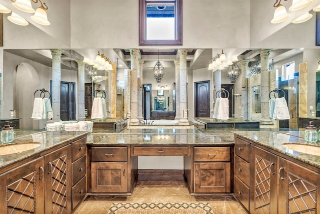 bathroom with vanity and decorative columns