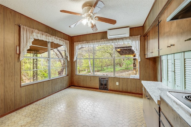 interior space with wood walls and light tile patterned floors