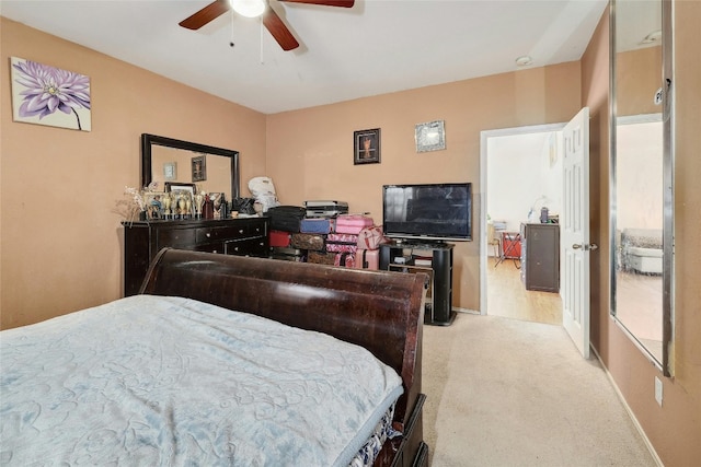 bedroom featuring ceiling fan and light colored carpet