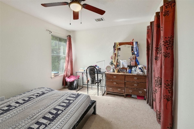 bedroom with ceiling fan and light colored carpet