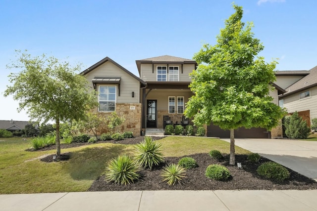 view of front of house with a front yard and a garage