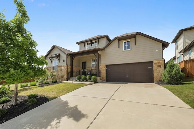 view of front of house featuring a front yard and a garage