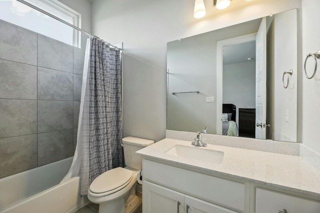 full bathroom featuring shower / bath combination with curtain, large vanity, and toilet