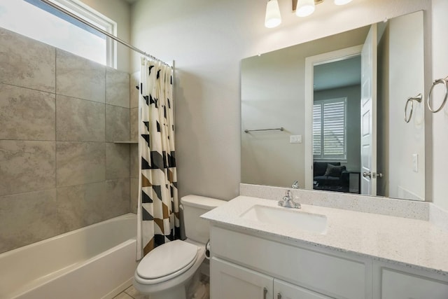 full bathroom featuring shower / bath combo with shower curtain, toilet, and vanity