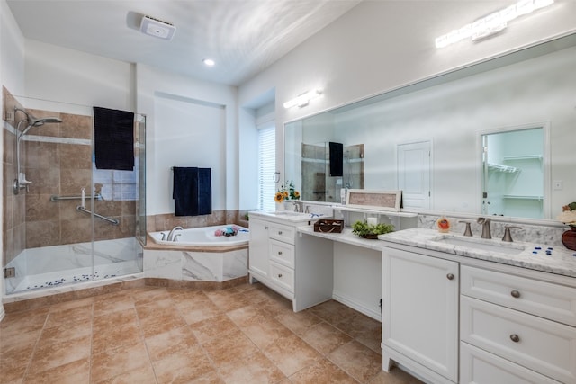 bathroom with tile flooring, separate shower and tub, and vanity