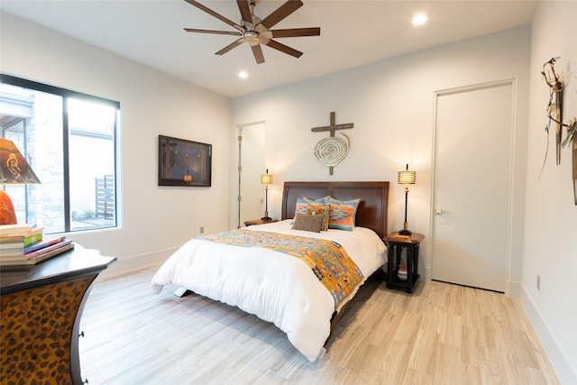 bedroom featuring light wood-type flooring and ceiling fan