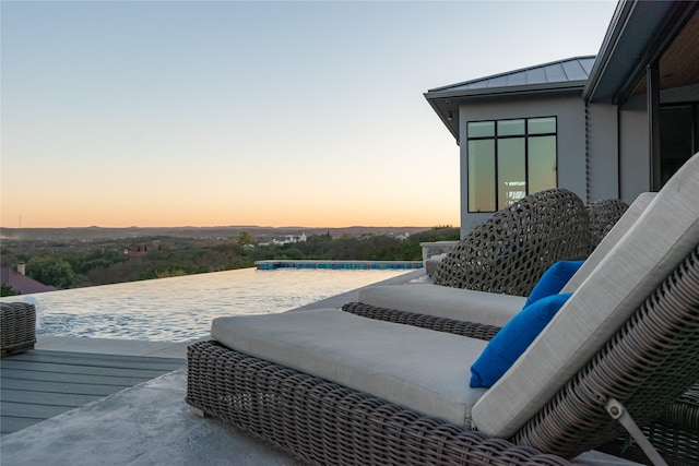 view of patio terrace at dusk