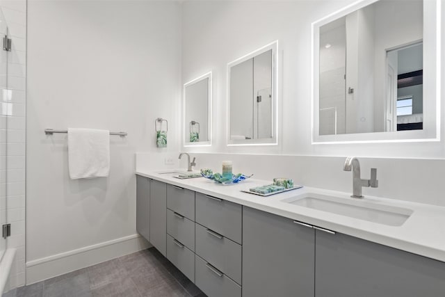 bathroom featuring double vanity and tile flooring