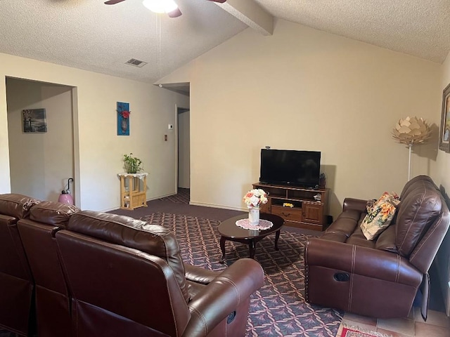 living room featuring vaulted ceiling with beams, ceiling fan, and a textured ceiling