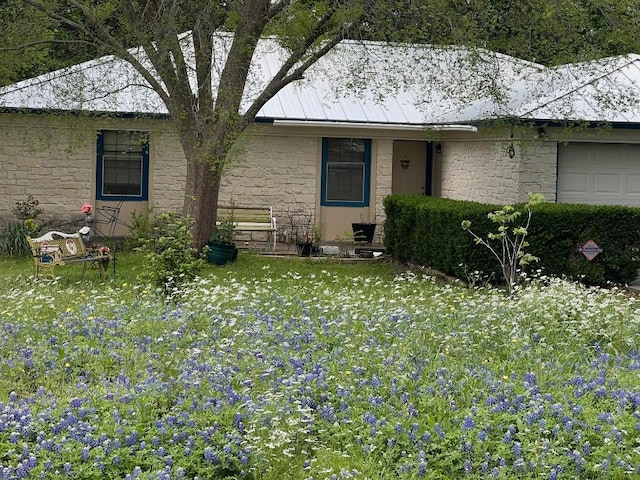 back of property featuring a garage