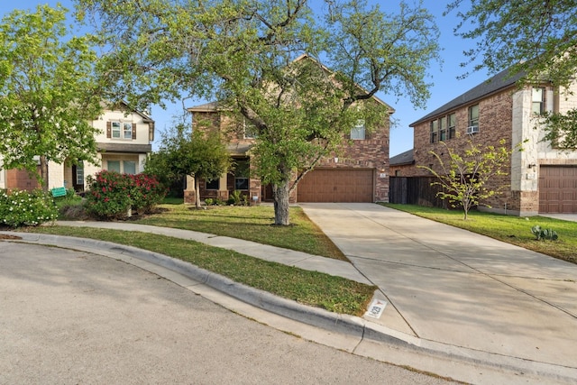 view of front of home with a front yard and a garage