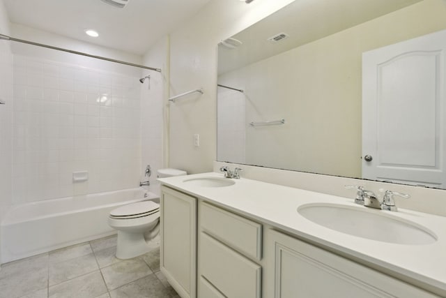 full bathroom featuring tile patterned floors, toilet, vanity, and tiled shower / bath