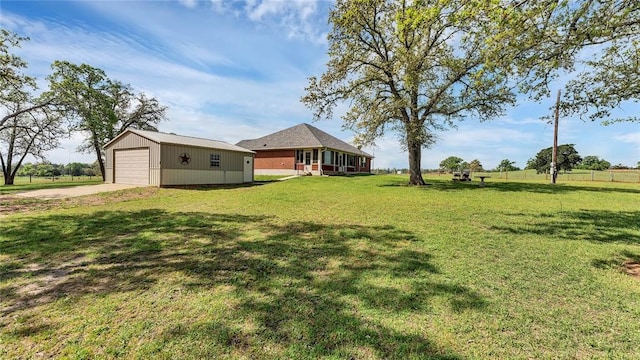 188 Zindler Ln, Paige, TX 78659 - view of yard featuring an outdoor structure and a garage