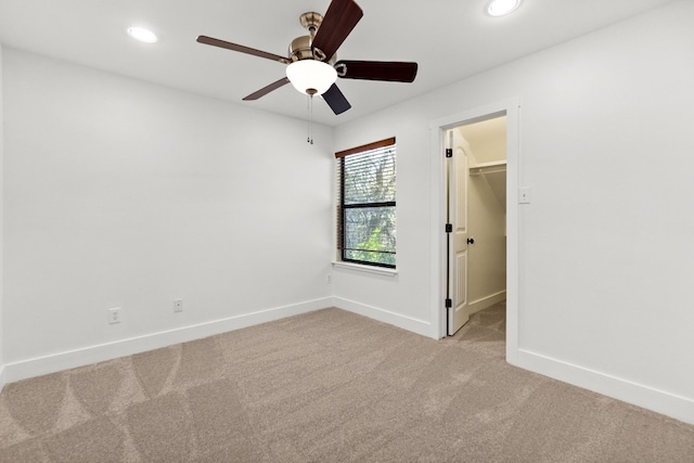 unfurnished room with a ceiling fan, carpet, baseboards, and recessed lighting