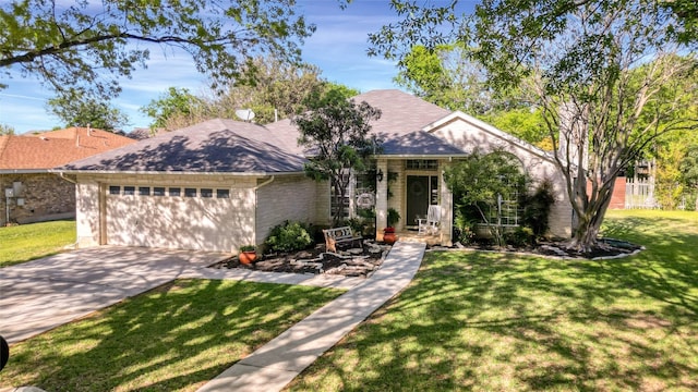 view of front of property with a garage and a front lawn