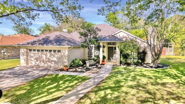 view of front of house featuring a garage and a front yard