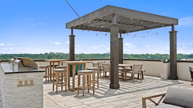 view of patio featuring area for grilling and an outdoor bar