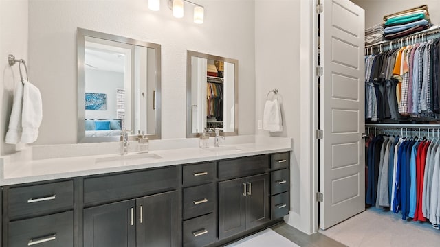 bathroom featuring tile patterned flooring and vanity