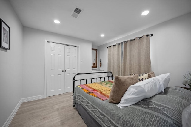 bedroom with a closet and light wood-type flooring