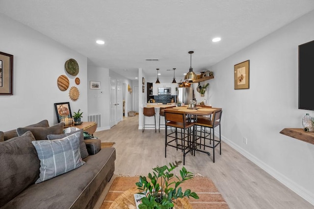 living room with light wood-type flooring