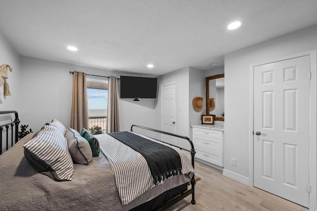 bedroom with light wood-type flooring