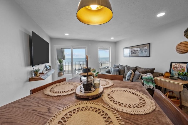 dining space with a textured ceiling